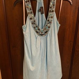 Sleeveless top with cute beading on Vneck.